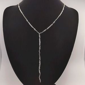 Silver necklace with small grey stone and rhinestone accents